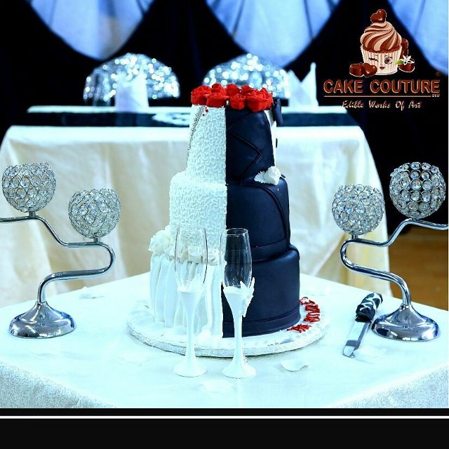 A black & white cake with red flowers by Cake Couture 256
