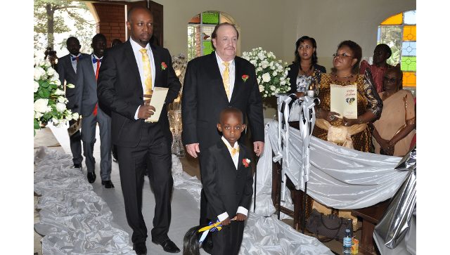 Groomsmen walk into church for a wedding ceremony