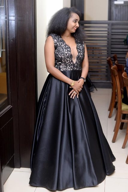 Cloaked in a sleek dress by Bloodworth