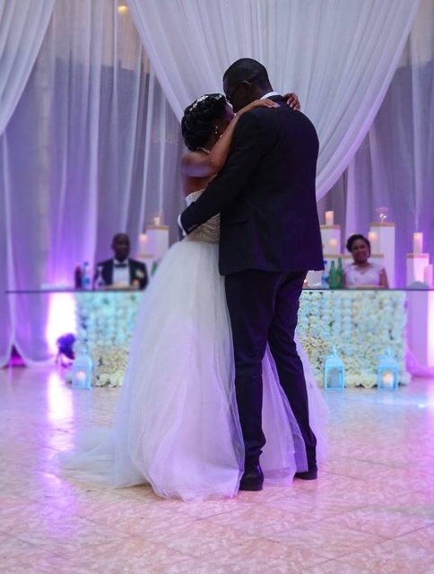A bride and groom on the dance floor at Mackinnon Suites