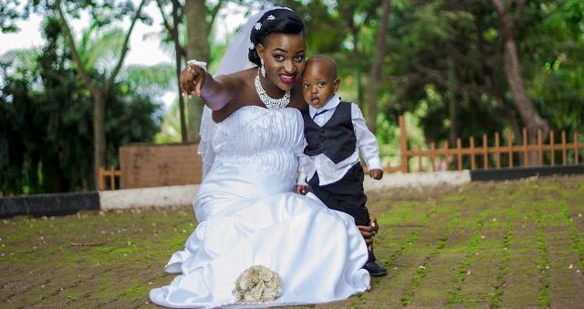 A bride and her pageboy during a wedding photo shoot powered by Frame Media
