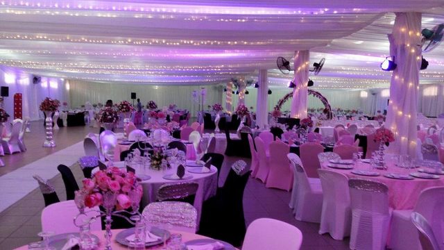 Indoor venue wedding decorations by Mugagga Events