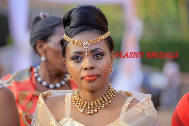 Barbara's Kwanjula Bridal Wear: Gold and Red Gomesi