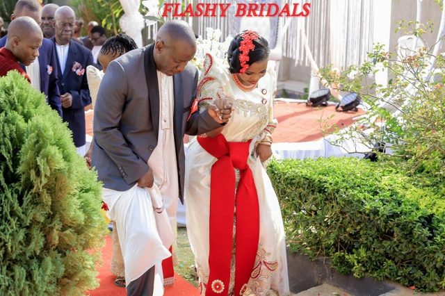 Barbara's Kwanjula Bridal Wear: Gold and Red Gomesi