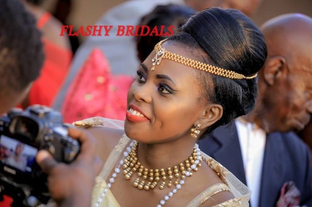 Barbara's Kwanjula Bridal Wear: Gold and Red Gomesi