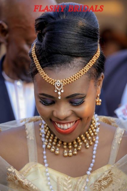 Barbara's Kwanjula Bridal Wear: Gold and Red Gomesi