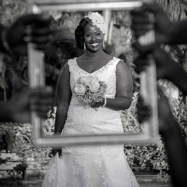A gorgeous bride dressed by Nisha's Bridal posing for a photo moment on her wedding