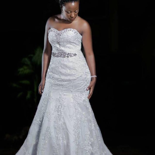 A model bride in a strapless mermaid wedding dress from Nisha's Bridal