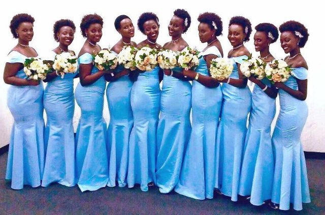 Bridesmaids in tailored outfits by Nisha's Bridals