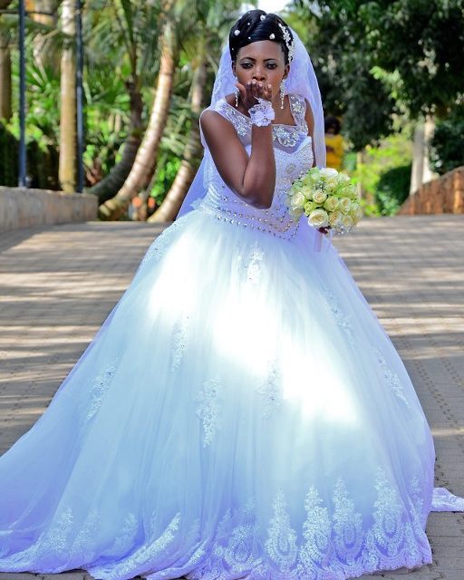A elegant bride at wedding photo shoot at the Commonwealth Resort Munyonyo