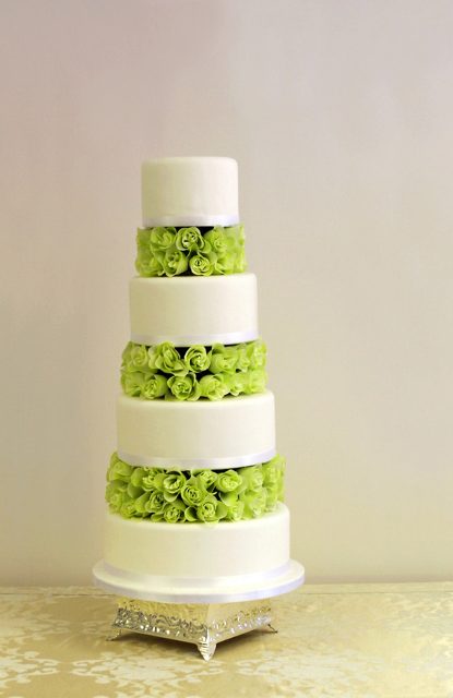 Four tier cake with a blend of flowers from Elieonai Cakes