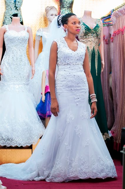 A model in a V-mermaid gown by Lady Scarlet Bridals