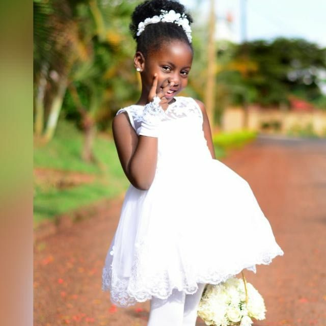 Ugandan flower girl dressed by Peponi Clothings