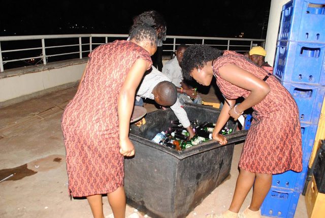 Semau Drinks ushers serve drinks at the Technology Associated dinner, Garden City roof toop