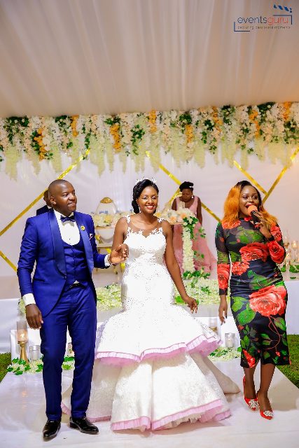 Rema delivering her performance at Ashbert & Richbell's wedding