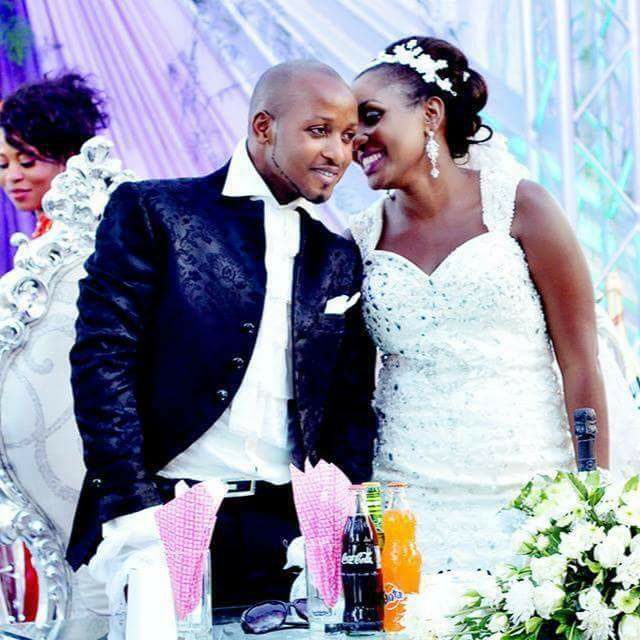 Tracy & her groom at their wedding reception, dressed by Aggie's Bridals