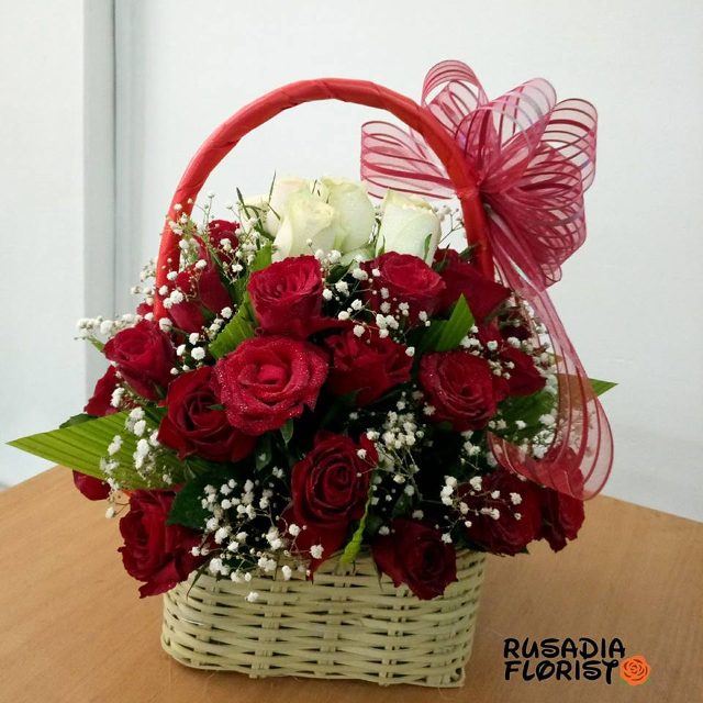 A basket of red and white roses from Rusadia Florists and Decorations