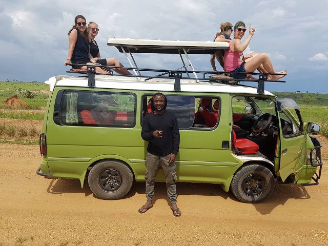 Excited tourists during a tour in Uganda